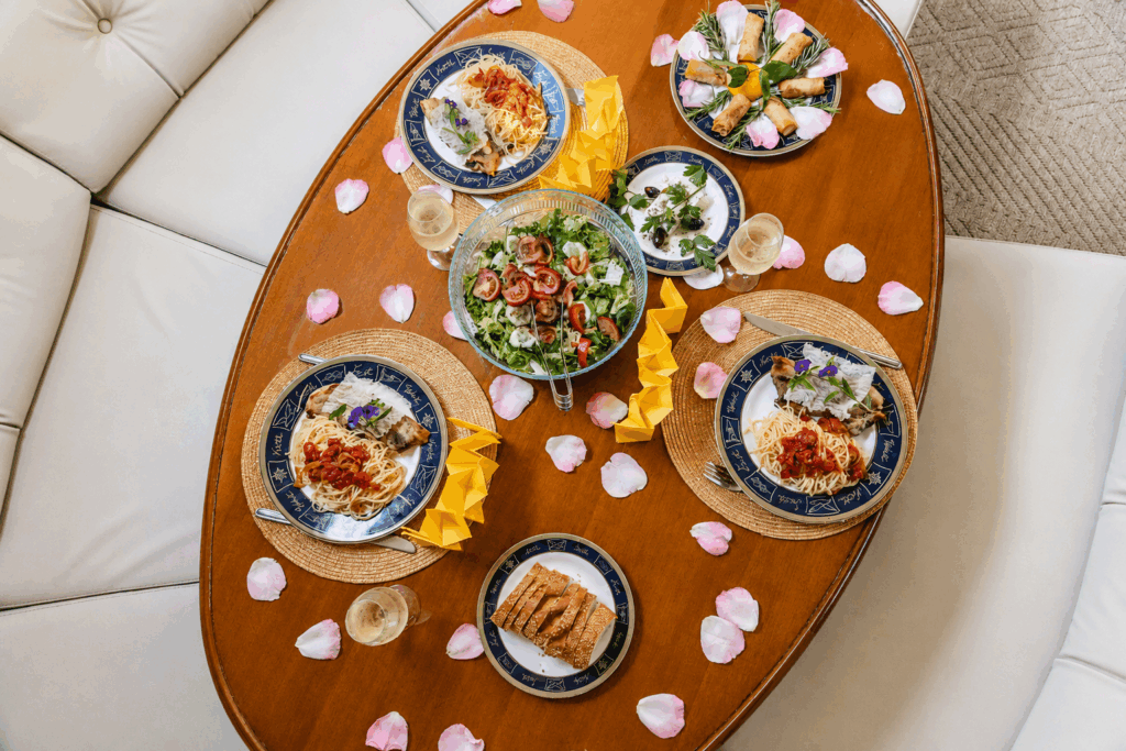 Elegant dining setup with rose petals on Edisa in Rhodes