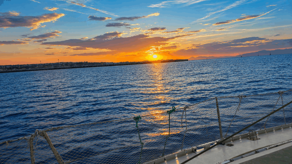 Sunset Over a Tranquil Ocean - Private Deluxe Sunset Dinner Aboard Sailing Edisa